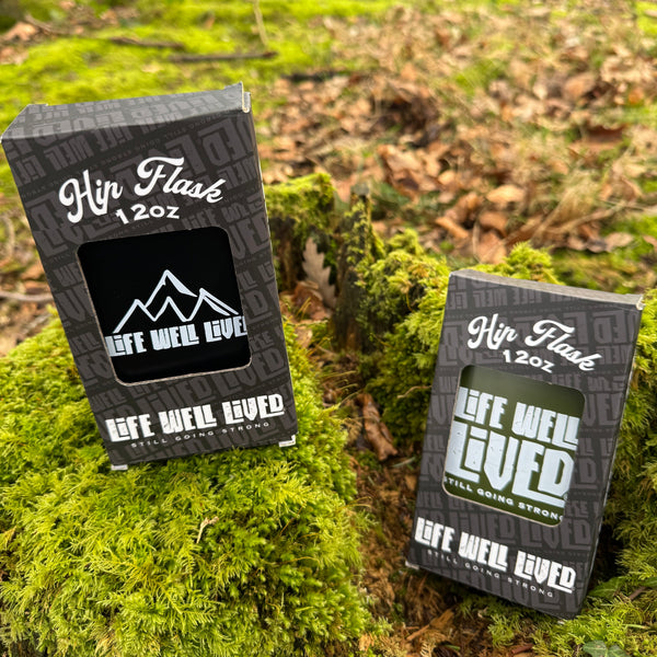 Life Well Lived Black mountain logo hip flask made from stainless steel, ideal for camping, hiking, festivals and gifts.