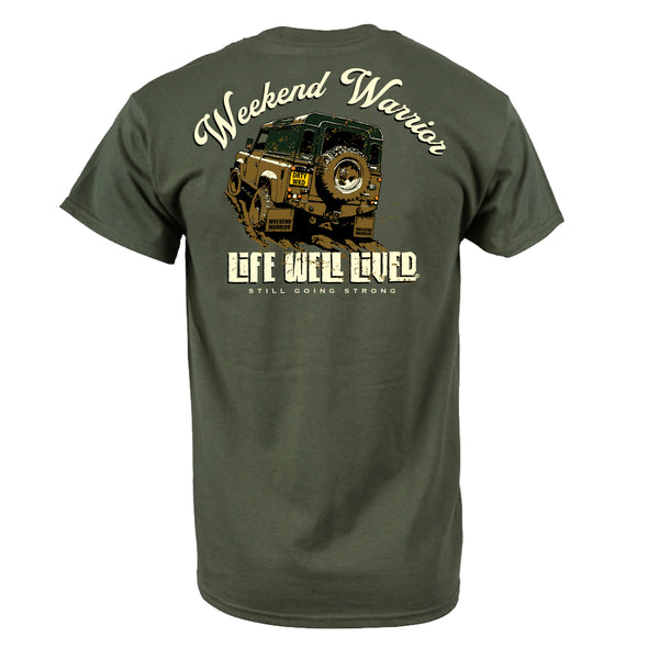 Back view of olive green Weekend Warrior T‑shirt featuring rugged off road 4x4 driving through mud with Weekend Warrior text above and Life Well Lived Still Going Strong branding below.