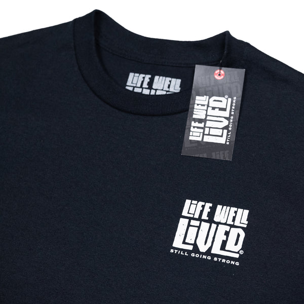 A classic black mens graphic Tee with simple white graphics depicting an old hotrod car on the back in white, the strapline reads 'Well Oiled & still Going Strong'