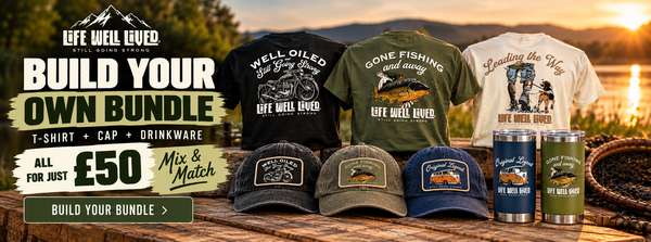 Promotional bundle graphic for Life Well Lived apparel and accessories, showing several branded T-shirts, caps, and tumblers arranged on a wooden surface with a mountain sunset background. Large text advertises building your own bundle for £50.