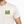 Man wearing a white t-shirt with 'Life Well Lived' text on a white background