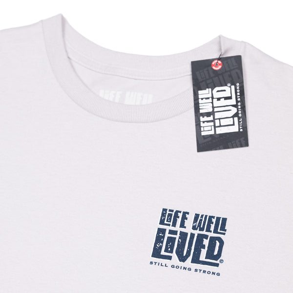 A Mens graphic Tee, depicting a Tuna fish leaping from the water next to a fishing boat, the words Deep Blue Guru are arched above the image with the Life well lived log underneath, all on an Ice grey colour Tee shirt.