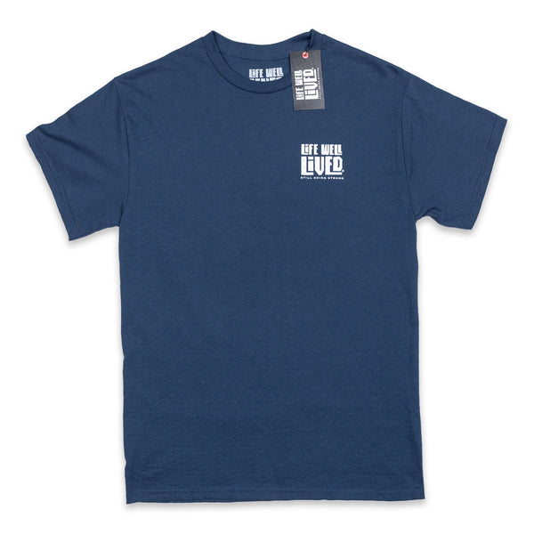 Classic mens back print graphic Tee, depicting a red wine bottle next to a glass of wine being poured, Above the image it reads 'Full Bodied Vintage in white lettering. The Tee is on a blue Dusk colour. Underneath the image it reads 'Life Well Lived, 'still going strong'.
