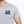 Gray t-shirt with 'Life Well Lived' text on a white background