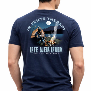 Back view of a male model wearing the navy In Tents Therapy camping T‑Shirt featuring the night‑time camp scene graphic with In Tents Therapy and Life Well Lived text.