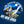  Stunning Navy blue T shirt, a back printed  Camping themed design T shirt, there is a man sat in the moonlight over a lake, he is sat with his dog snug on his lap in his tent. He has a campfire burning in front of him and a beer in his hand. The smoke from the campfire is drifting up over the lake in front of a full moon, The image is in a circular style and located in the middle of the T shirt. the strapline says 'In Tents Therapy' and blow is the brand logo 'Life Well Lived',  small logo on front chest.