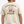 Man wearing a beige t-shirt with 'Lord of the Seas' graphic design.