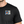 Male model wearing the black Modrophenia T‑Shirt showing the small front chest logo.