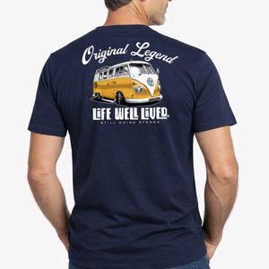 Man wearing a navy blue t-shirt with a graphic and text on the back, standing against a white background.