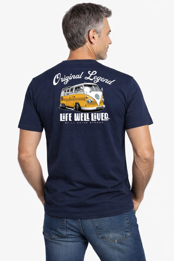 Man wearing a navy blue t-shirt with a graphic and text on the back, standing against a white background.