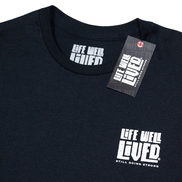 Mens graphic Tee in Black, red and yellow image on shoulders saying 'Life Well Lived Hometown hero'.