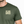 Person wearing a green t-shirt with 'Life Well Lived' text on a white background
